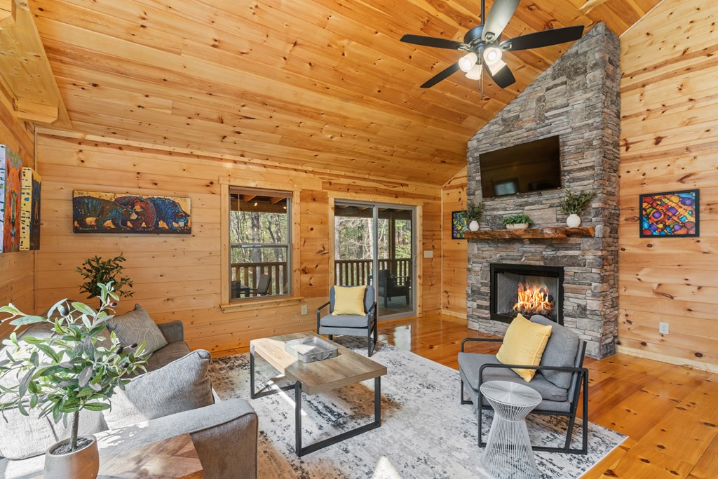 237 Bentley Cove Murphy, NC 28906 - Photo 4 of 43 a living room with patio fireplace furniture and a flat screen tv