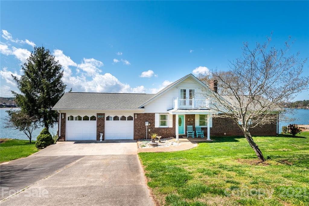 307 Kirkpatrick Road Taylorsville, NC 28681 - Photo 2 of 39 a front view of a house with a yard