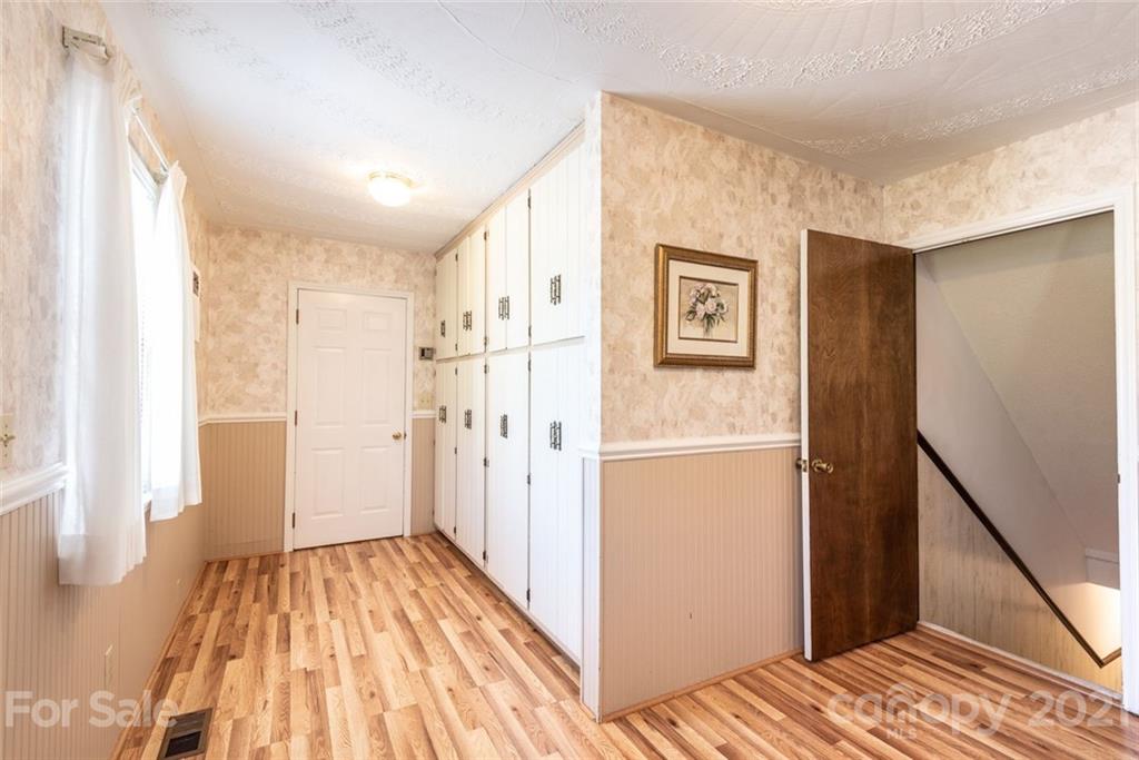 307 Kirkpatrick Road Taylorsville, NC 28681 - Photo 12 of 39 a view of a hallway with wooden floor and an empty room
