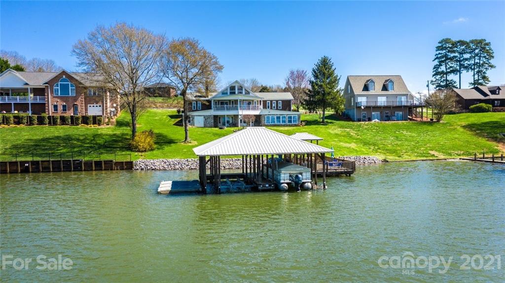 307 Kirkpatrick Road Taylorsville, NC 28681 - Photo 3 of 39 a aerial view of a house with swimming pool and large trees
