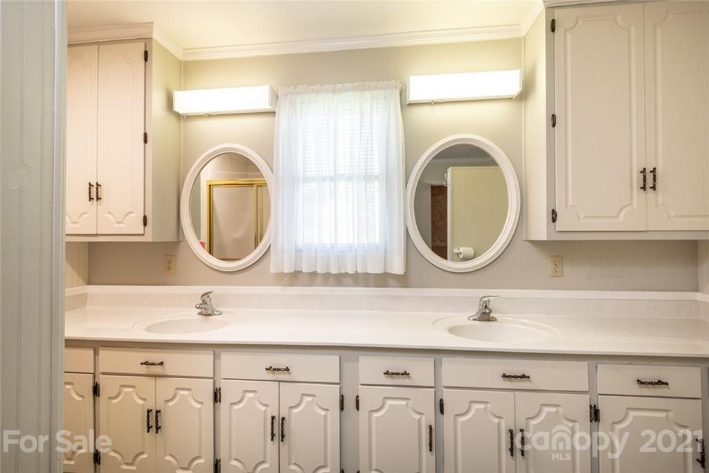 307 Kirkpatrick Road Taylorsville, NC 28681 - Photo 21 of 39 a bathroom with a sink and a mirror