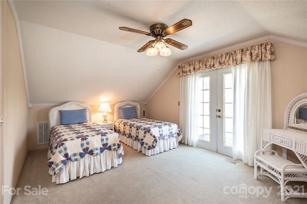 307 Kirkpatrick Road Taylorsville, NC 28681 - Photo 23 of 39 a bedroom with two beds and painting on the wall