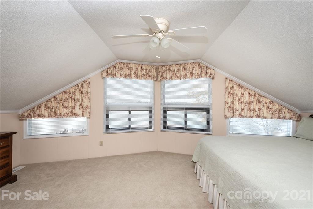 307 Kirkpatrick Road Taylorsville, NC 28681 - Photo 24 of 39 an empty room with windows and fan