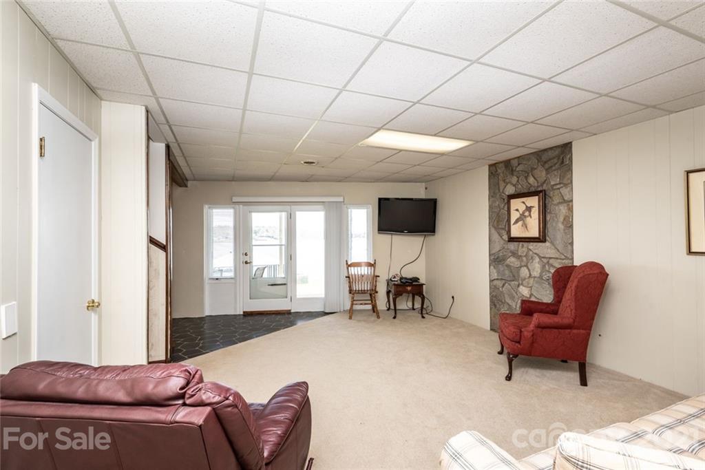 307 Kirkpatrick Road Taylorsville, NC 28681 - Photo 28 of 39 a living room with furniture and a flat screen tv