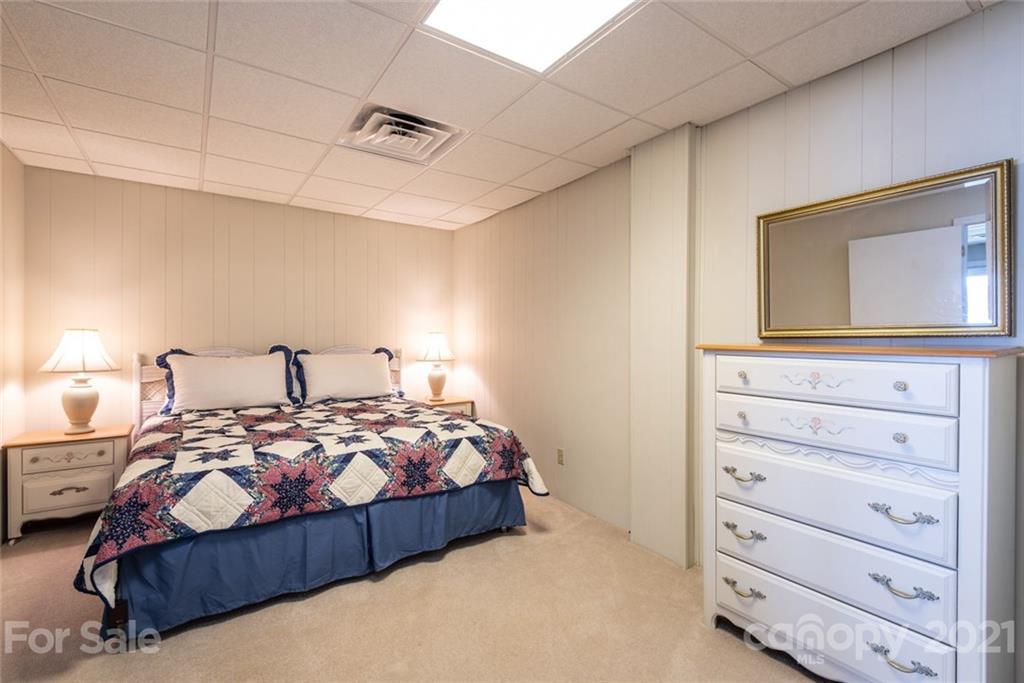 307 Kirkpatrick Road Taylorsville, NC 28681 - Photo 29 of 39 a bedroom with a bed and a dresser
