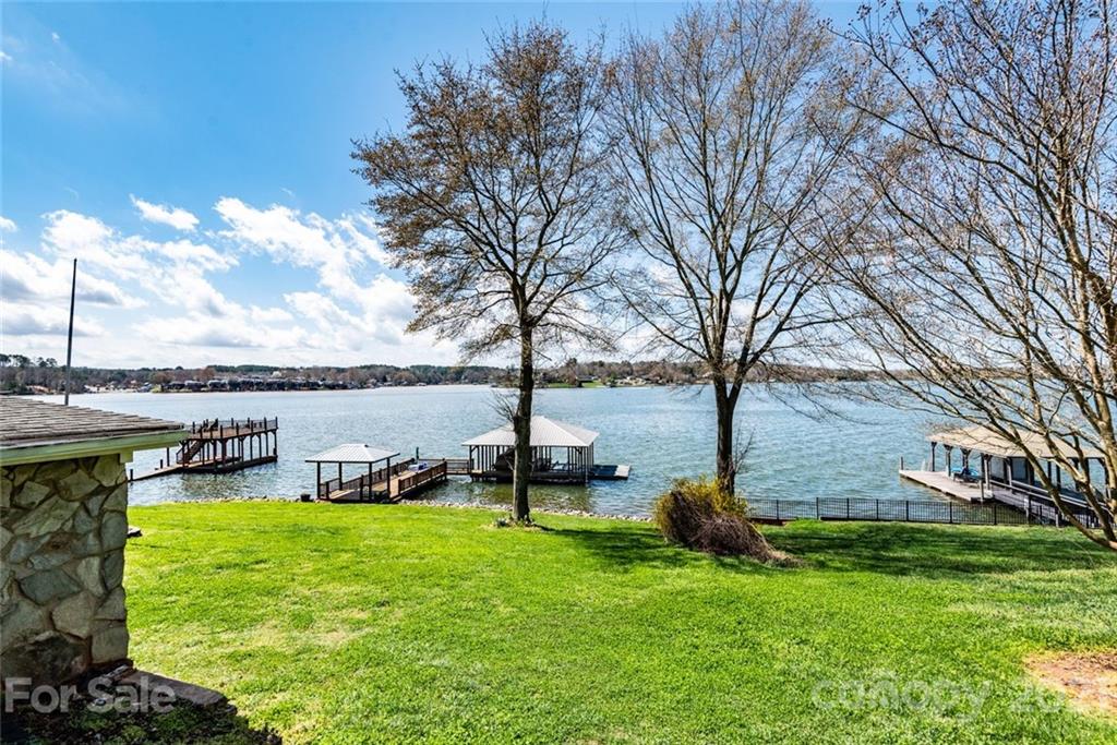 307 Kirkpatrick Road Taylorsville, NC 28681 - Photo 4 of 39 a lake view with a bench next to a yard