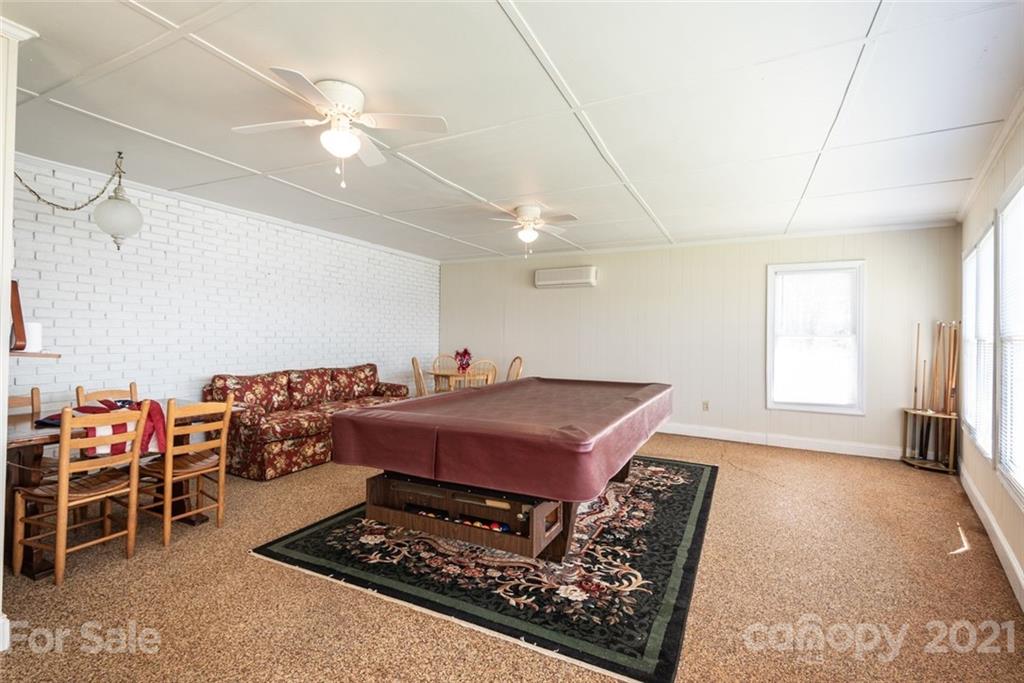 307 Kirkpatrick Road Taylorsville, NC 28681 - Photo 31 of 39 a living room with furniture a table and kitchen view