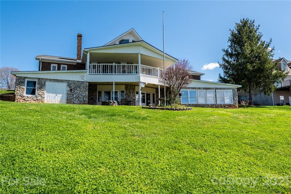 307 Kirkpatrick Road Taylorsville, NC 28681 - Photo 6 of 39 a front view of a house with a garden