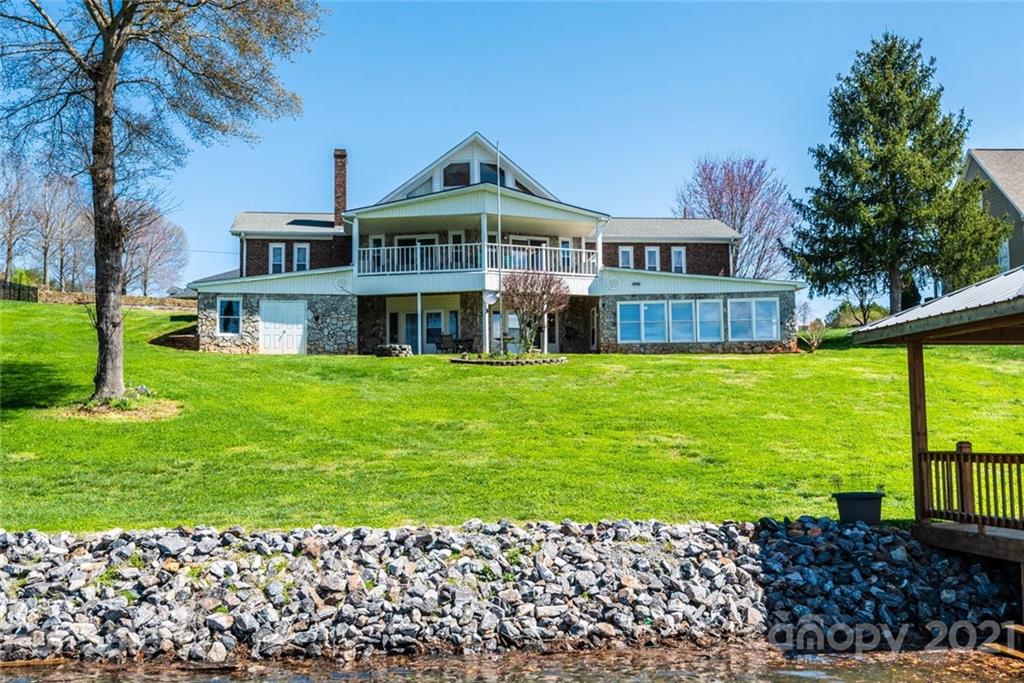 307 Kirkpatrick Road Taylorsville, NC 28681 - Photo 8 of 39 a front view of a house with a garden