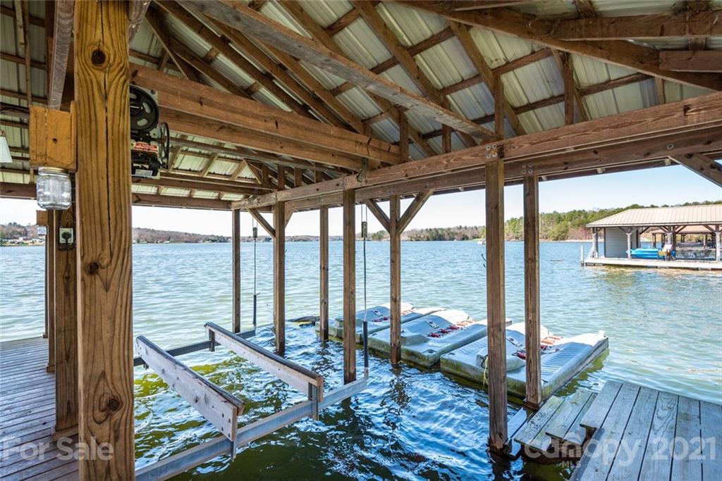 307 Kirkpatrick Road Taylorsville, NC 28681 - Photo 10 of 39 a view of a balcony with lake view and a floor to ceiling window