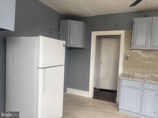 5630 Walnut Street, Unit 2 Philadelphia, PA 19139 - Photo 18 of 28 a white refrigerator freezer sitting in a kitchen