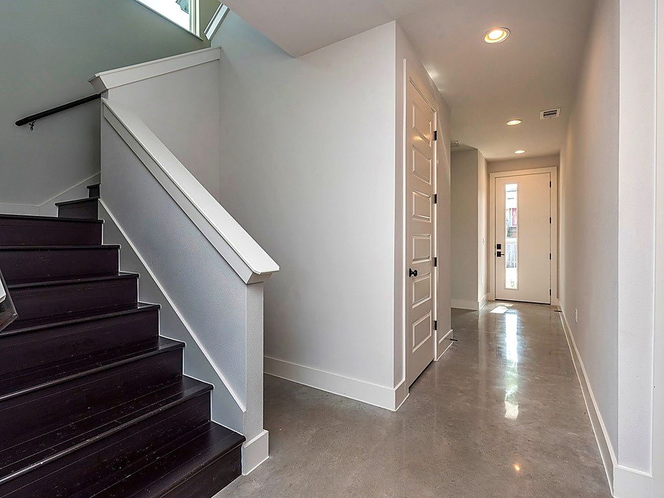 1182 Ridgeway Drive, Unit A Austin, TX 78702 - Photo 4 of 27 Staircase featuring concrete floors and recessed lighting