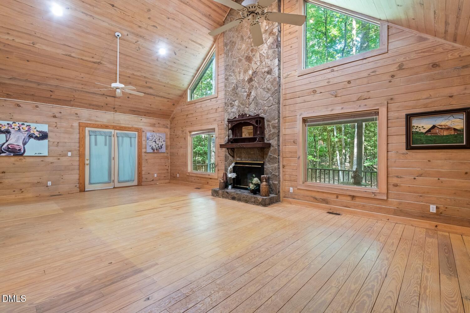 7391 Howerton Road Elon, NC 27244 - Photo 15 of 53 Vaulted wood-paneled ceiling with exposed beams and ceiling fans