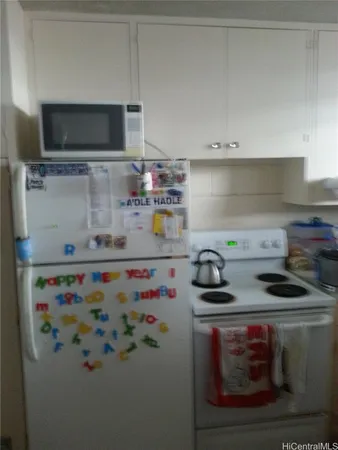 a kitchen with a stove and a microwave
