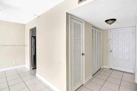 a view of a livingroom with an empty space and a window