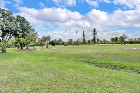 a view of cars parked in front of a building
