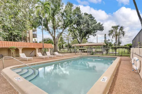 a view of a swimming pool with a patio