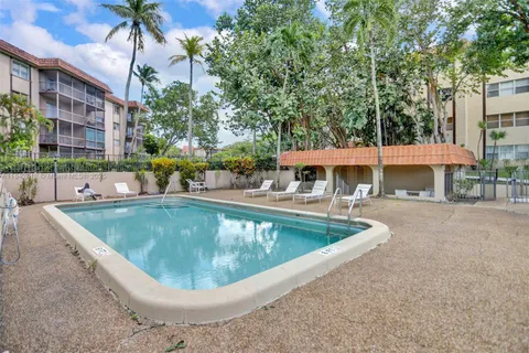 a view of a swimming pool with a patio