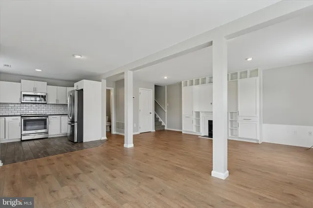 a view of kitchen with stainless steel appliances refrigerator oven and stove