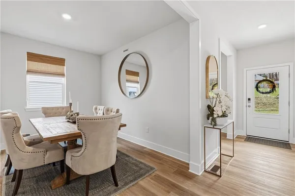 a view of a livingroom with furniture and wooden floor
