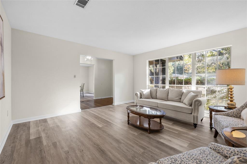 2110 Northwest 46th Street Gainesville, FL 32605 - Photo 11 of 31 a living room with furniture and a large window