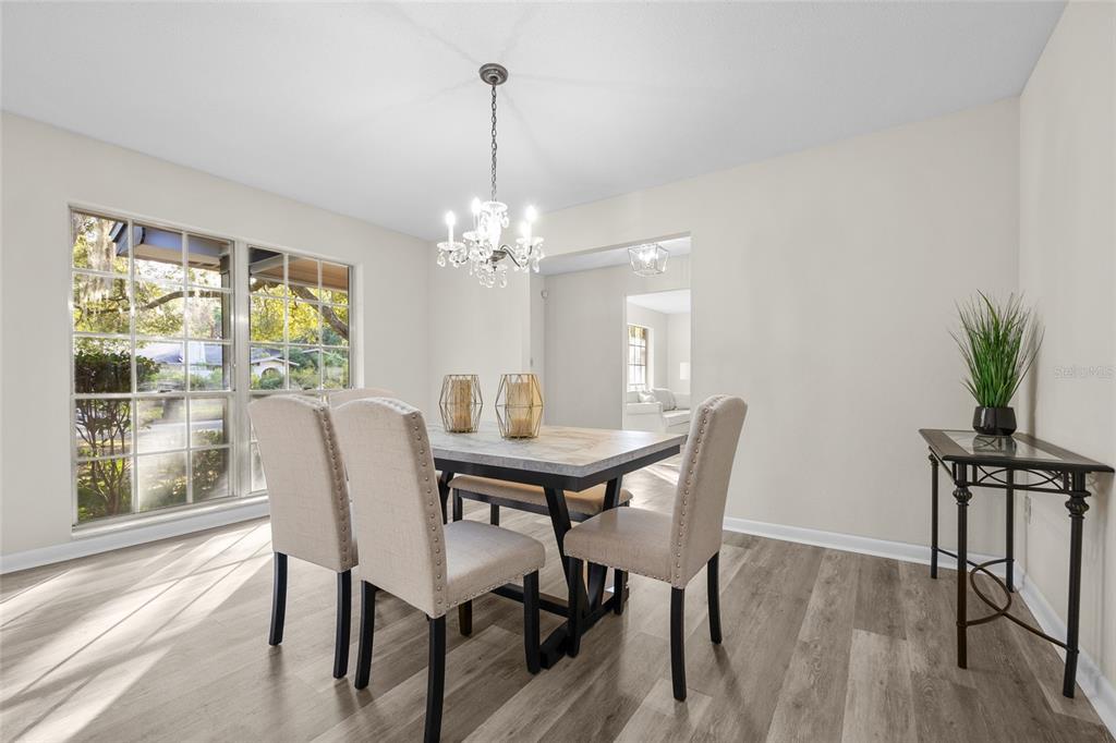 2110 Northwest 46th Street Gainesville, FL 32605 - Photo 9 of 31 a view of a dining room with furniture window and outside view
