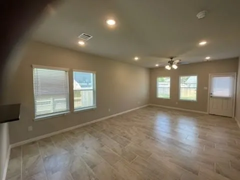 a kitchen with granite countertop a refrigerator and a sink