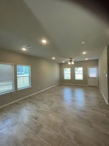 a kitchen with stainless steel appliances granite countertop a sink a stove and a microwave