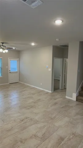 a view of an empty room with a window