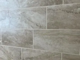 a bathroom with a sink vanity and a mirror