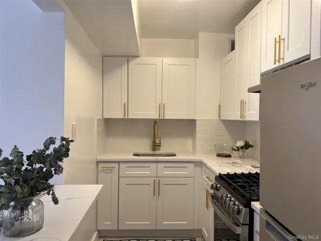 a kitchen with a sink and cabinets