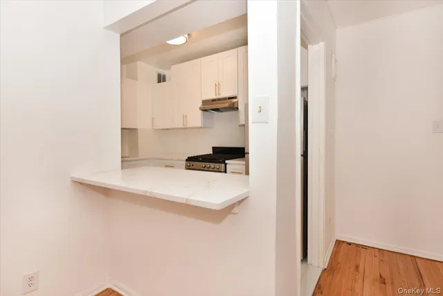 a kitchen with a sink and a refrigerator