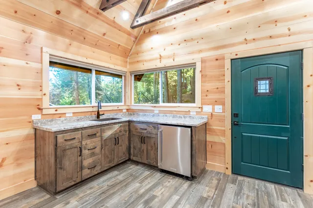 a view of a patio with a table and chairs