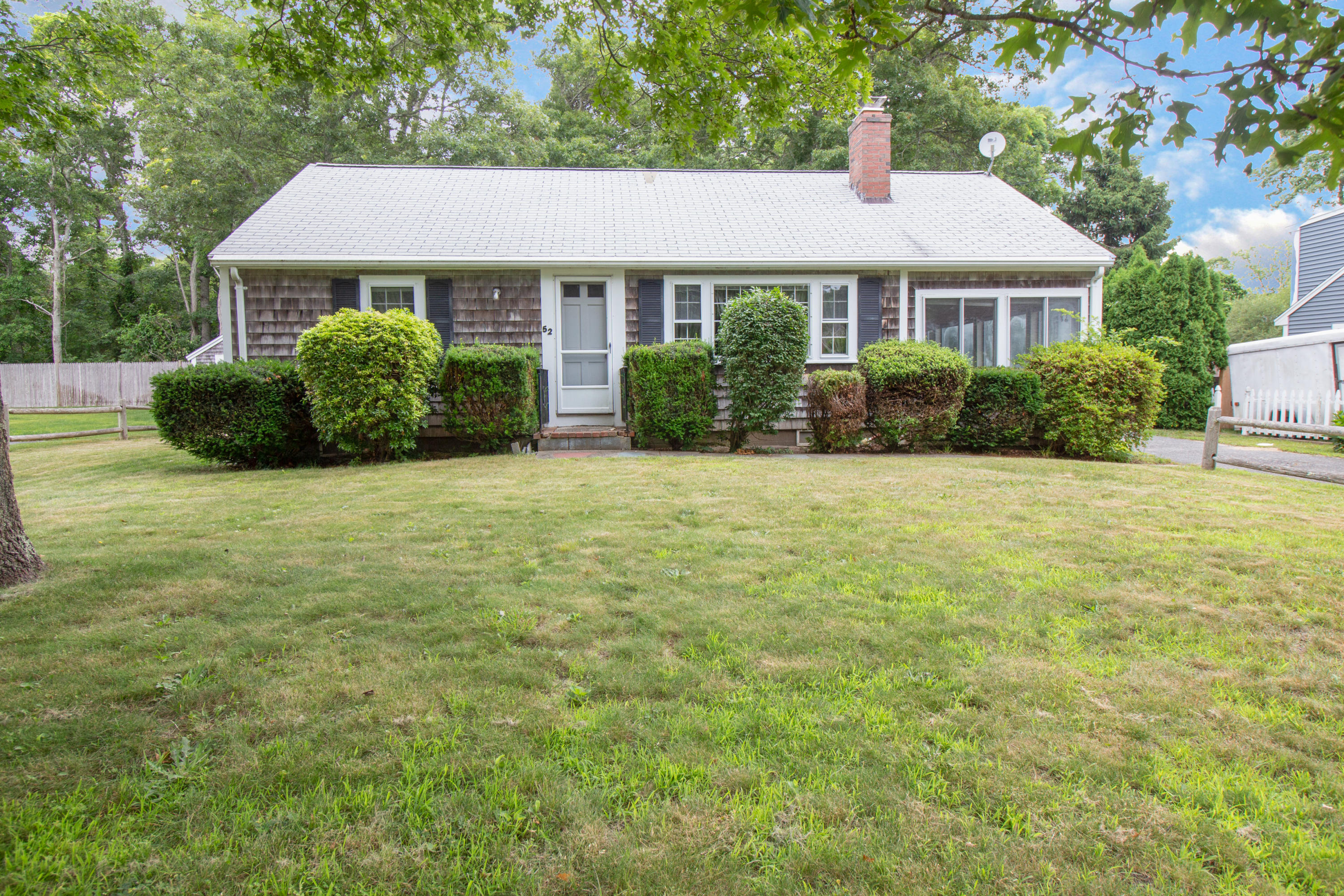 52 Farm Hill Road Centerville, MA 02632 - Photo 1 of 29 a view of a house with a yard and fence