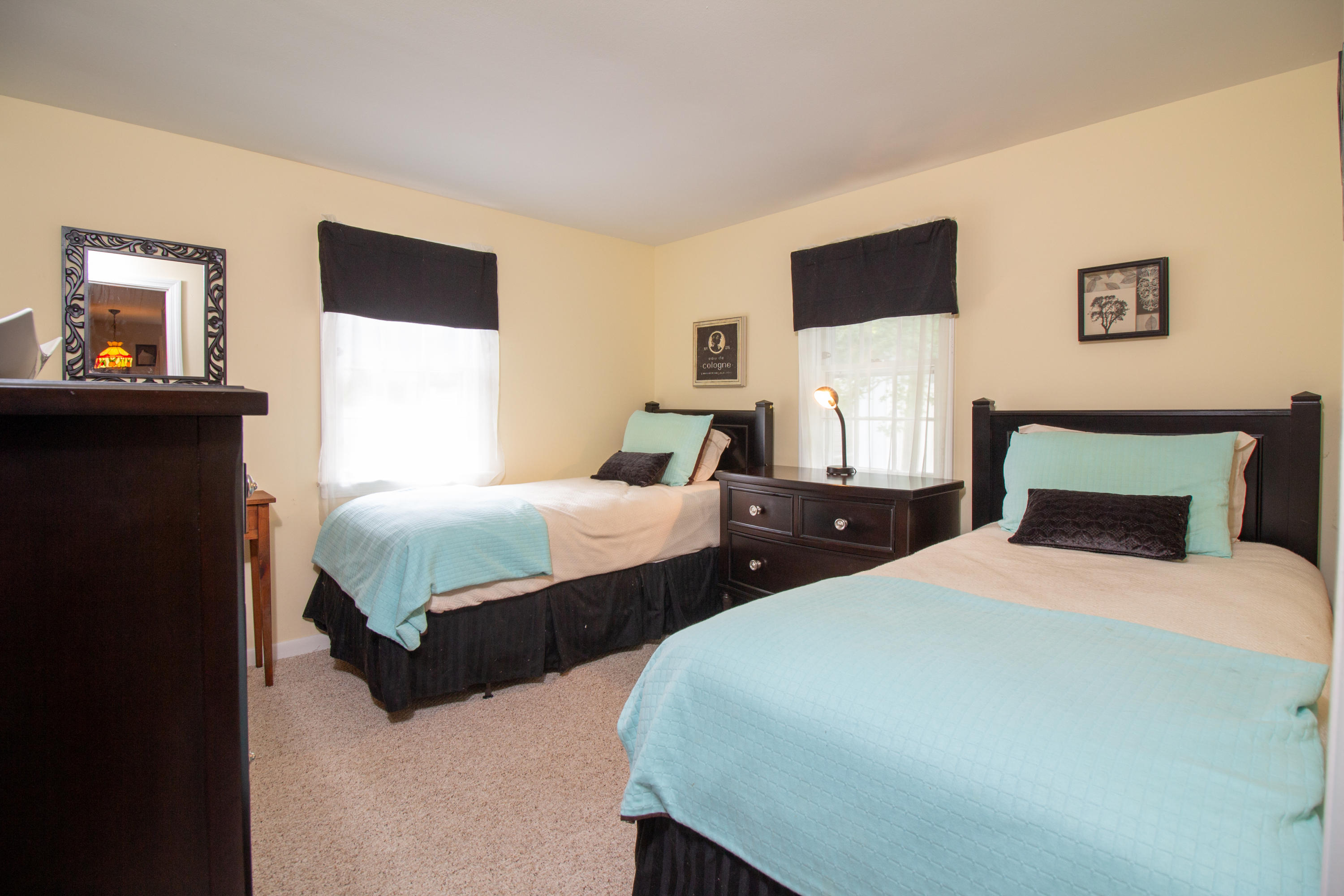 52 Farm Hill Road Centerville, MA 02632 - Photo 17 of 29 a bedroom with two beds and a wall painting