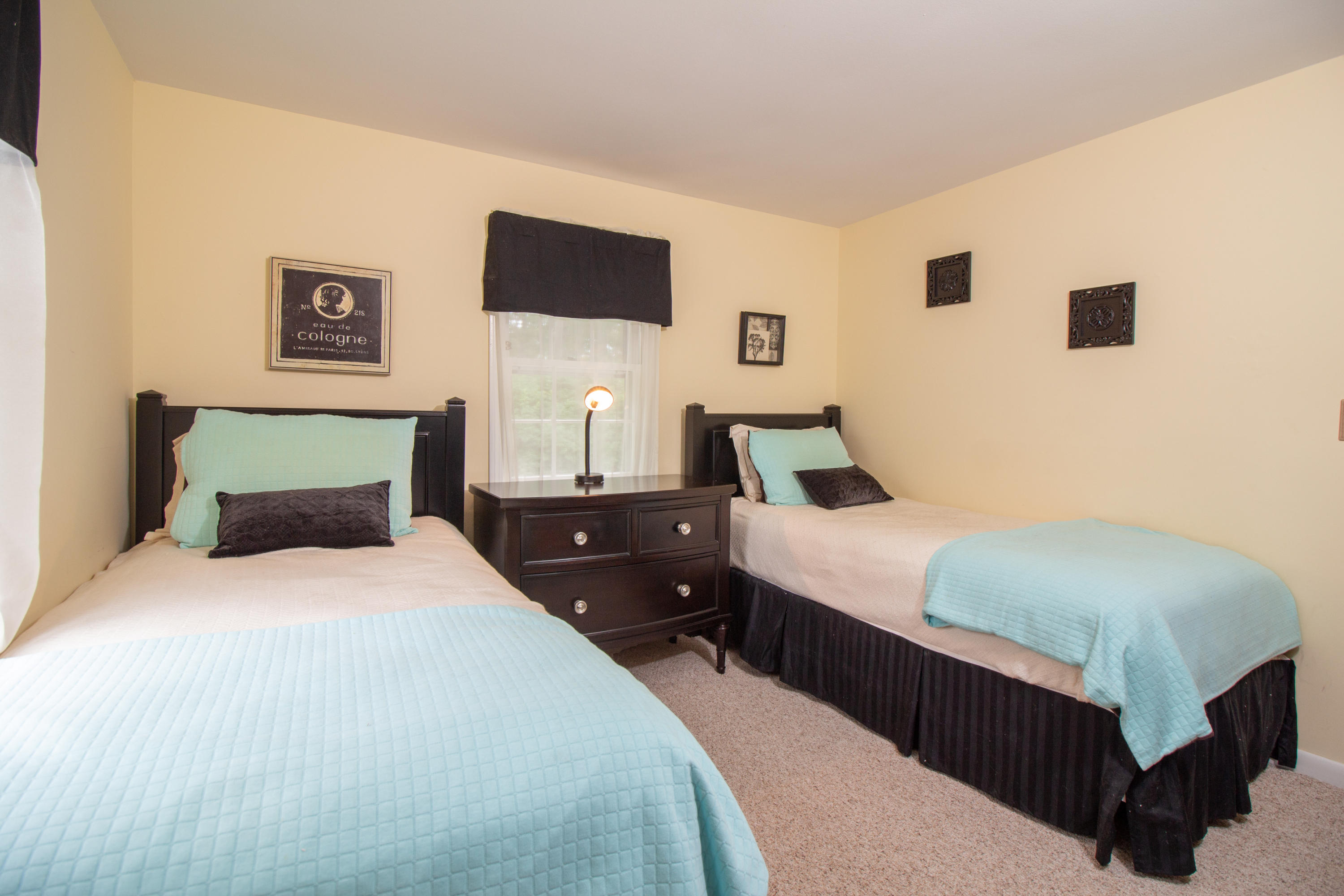 52 Farm Hill Road Centerville, MA 02632 - Photo 18 of 29 a bedroom with a bed and a flat screen tv