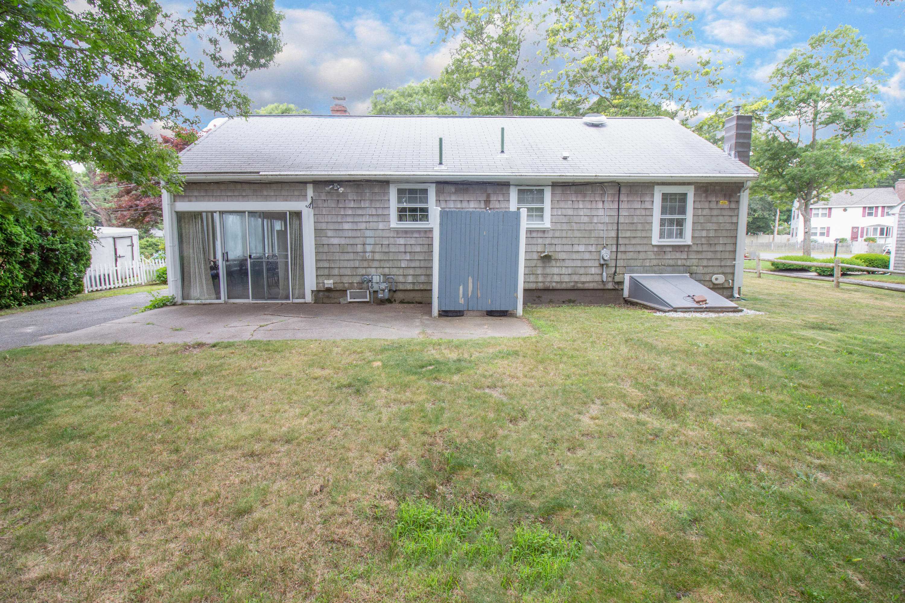 52 Farm Hill Road Centerville, MA 02632 - Photo 24 of 29 a view of a house with a yard and large tree