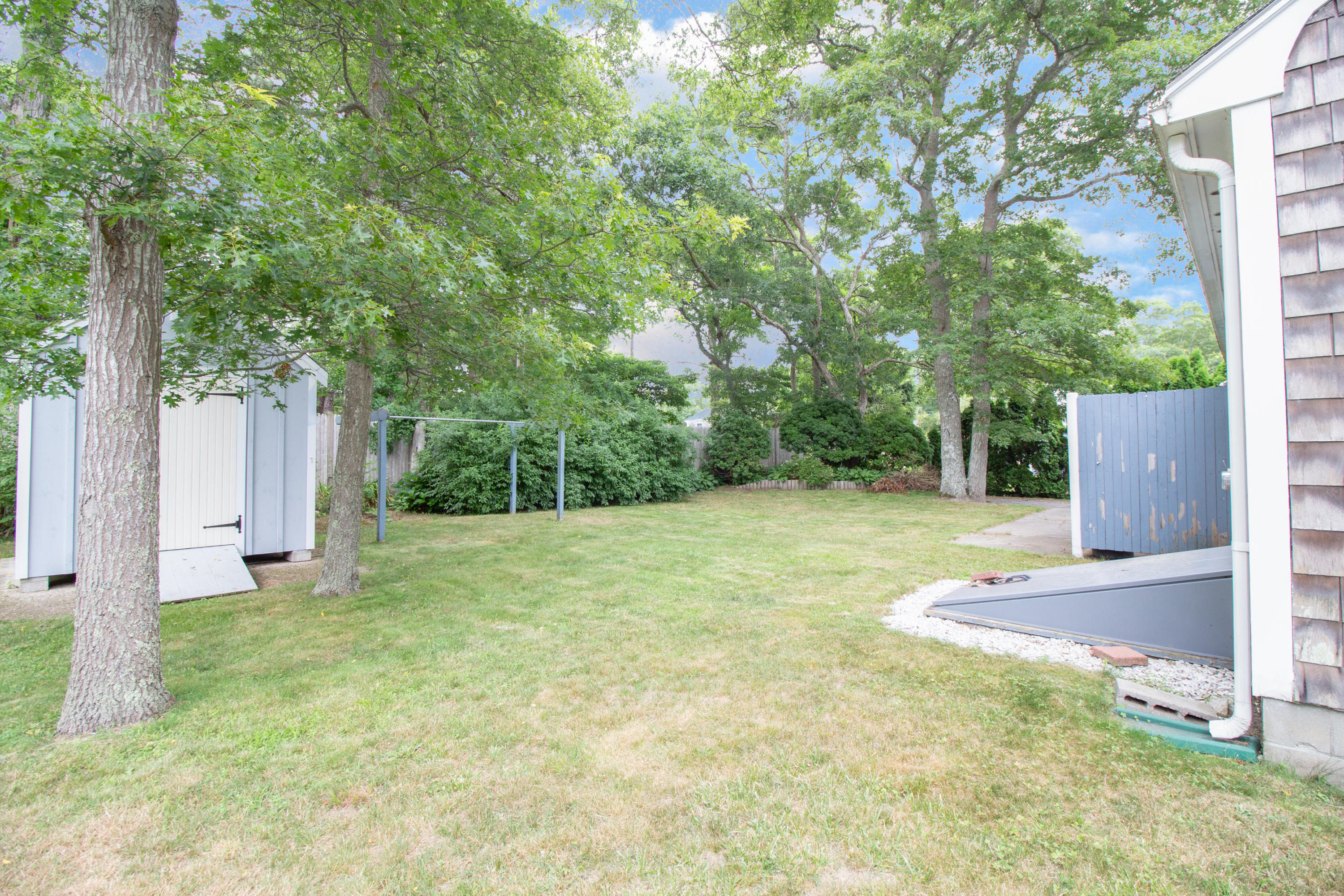 52 Farm Hill Road Centerville, MA 02632 - Photo 27 of 29 a view of a yard with a house and large tree
