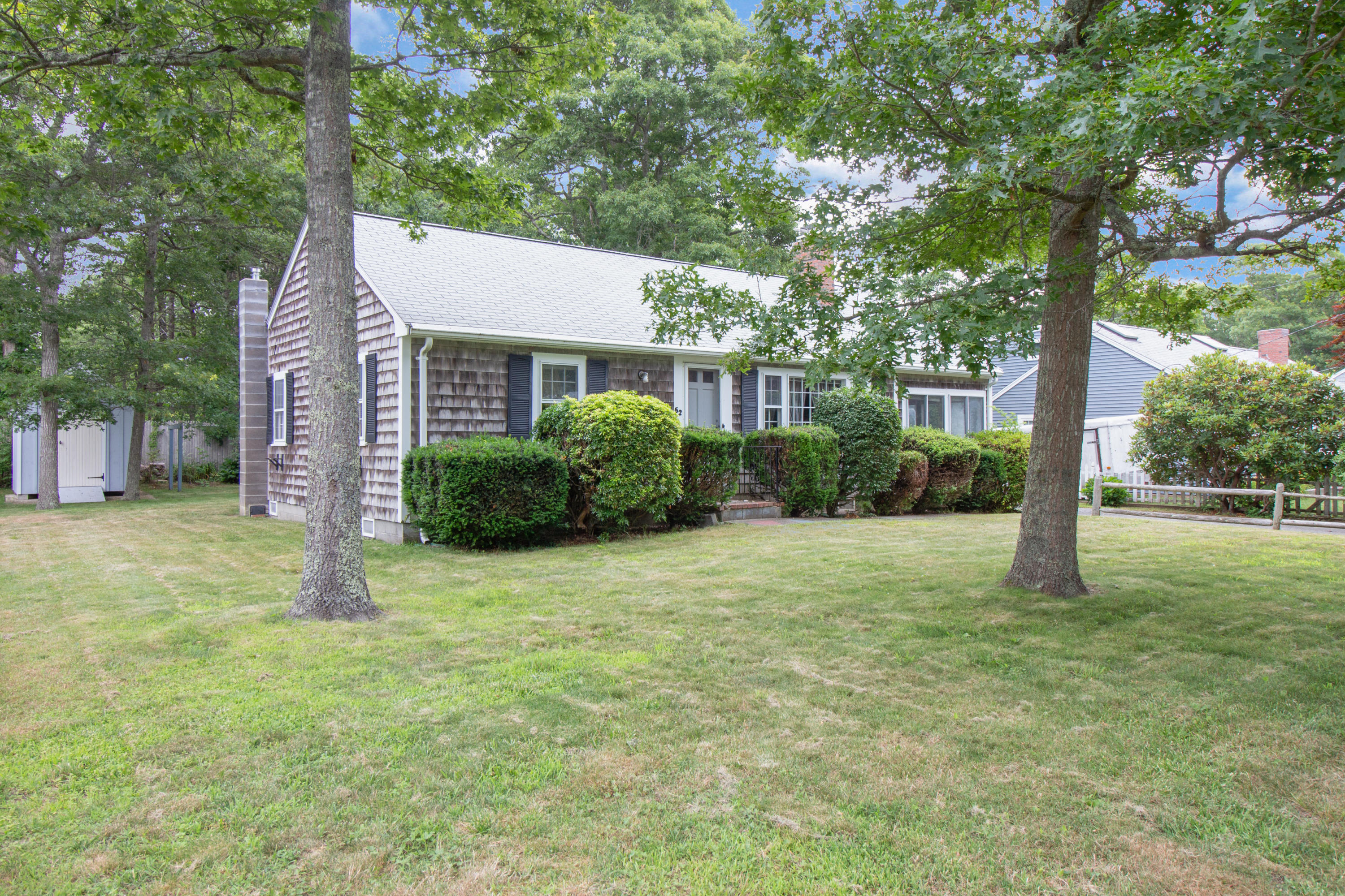 52 Farm Hill Road Centerville, MA 02632 - Photo 3 of 29 a house that has a tree in front of it