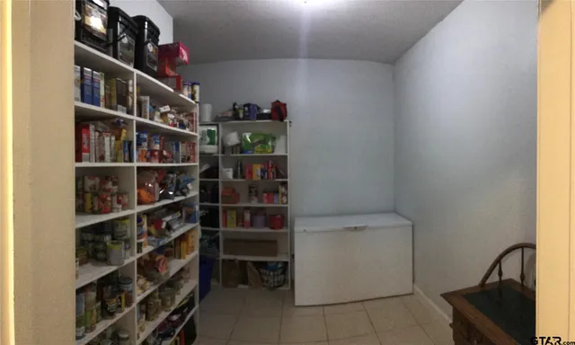 a room with a cabinets and a window