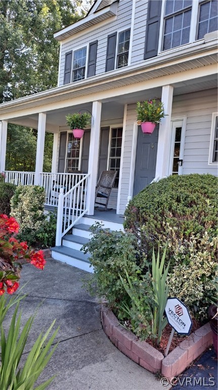 5707 Springmount Road Chesterfield, VA 23832 - Photo 2 of 24 Beautiful flowers make this full front porch a gre
