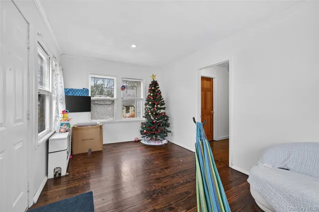 a room with furniture and wooden floor