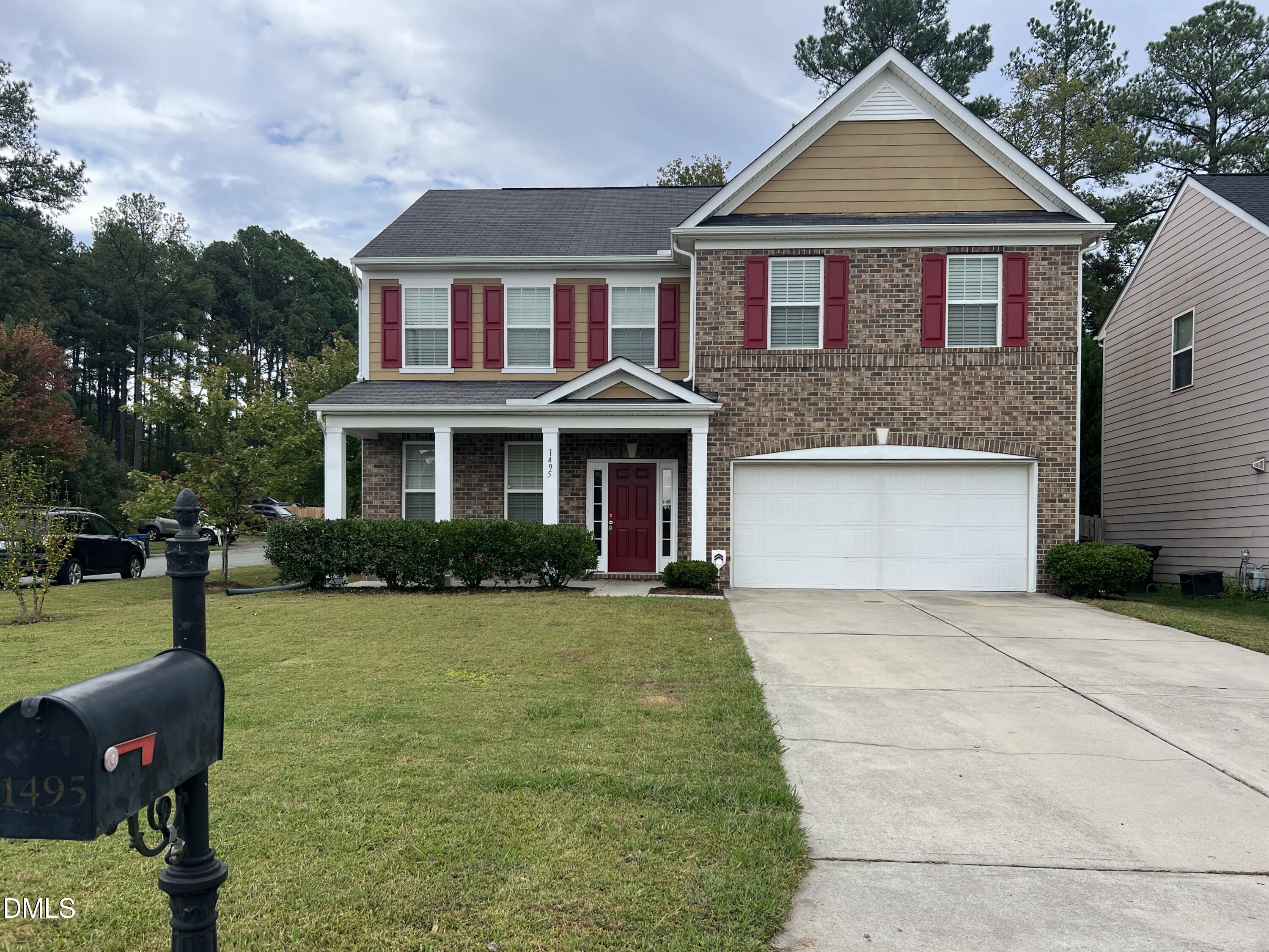 1495 Willowcrest Road Durham, NC 27703 - Photo 1 of 35 a front view of a house with garden