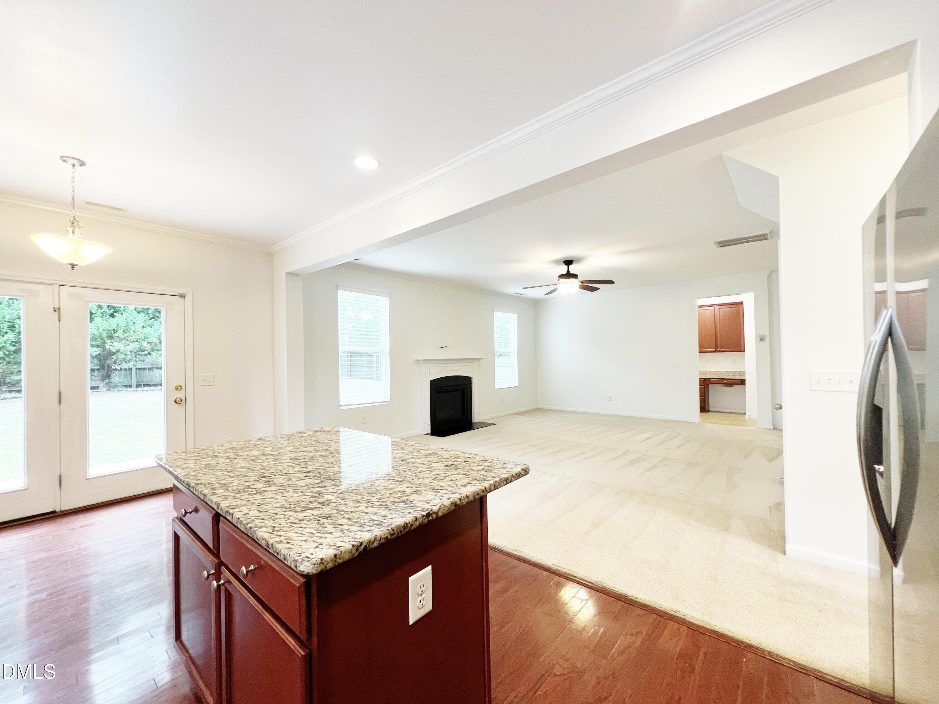 1495 Willowcrest Road Durham, NC 27703 - Photo 11 of 35 a kitchen with granite countertop sink and refrigerator
