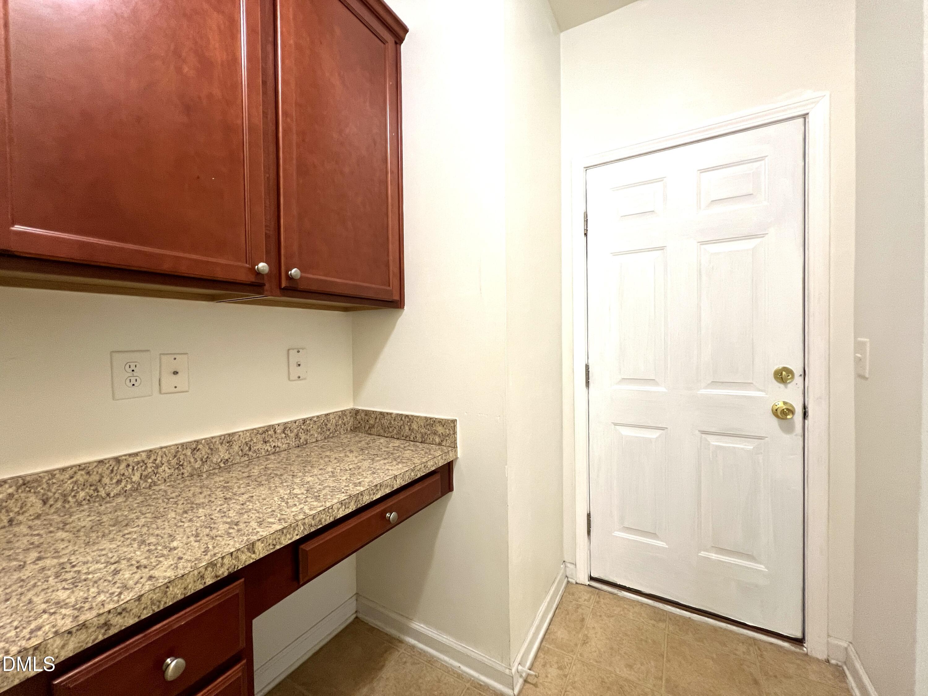 1495 Willowcrest Road Durham, NC 27703 - Photo 14 of 35 a view of kitchen and wooden floor