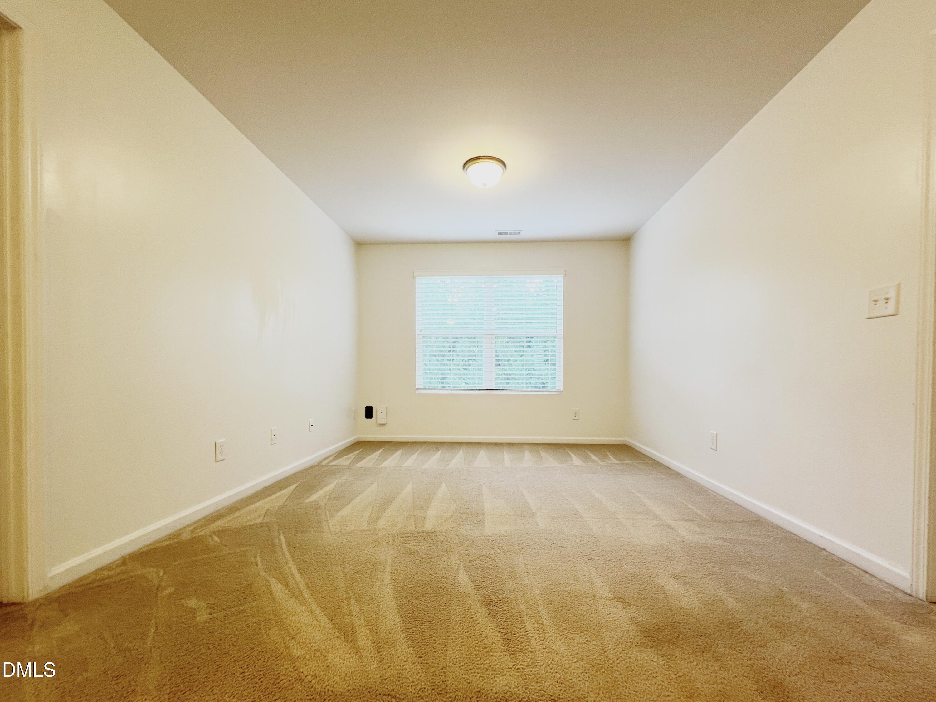 1495 Willowcrest Road Durham, NC 27703 - Photo 16 of 35 a view of an empty room with a window