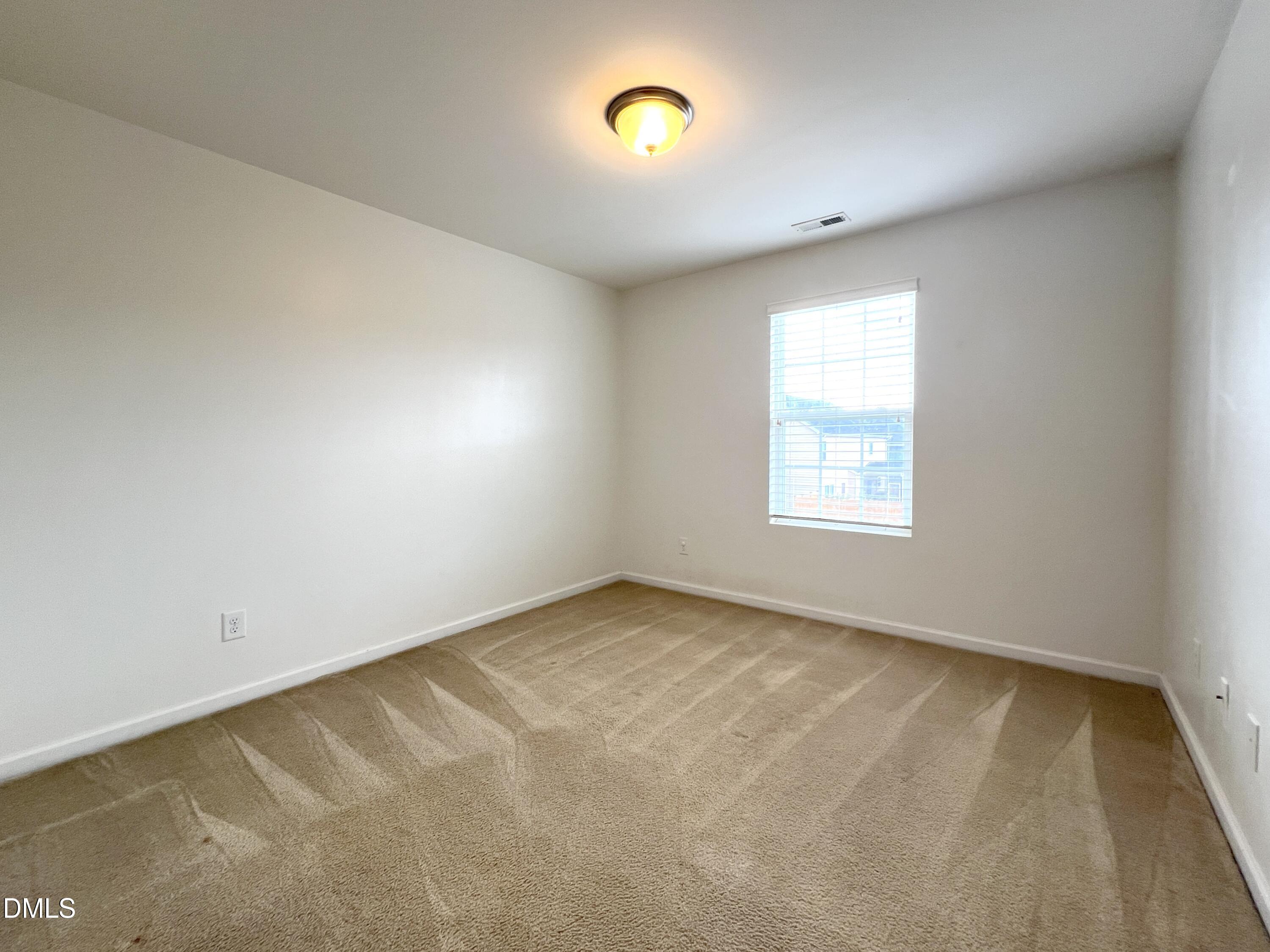1495 Willowcrest Road Durham, NC 27703 - Photo 17 of 35 an empty room with windows