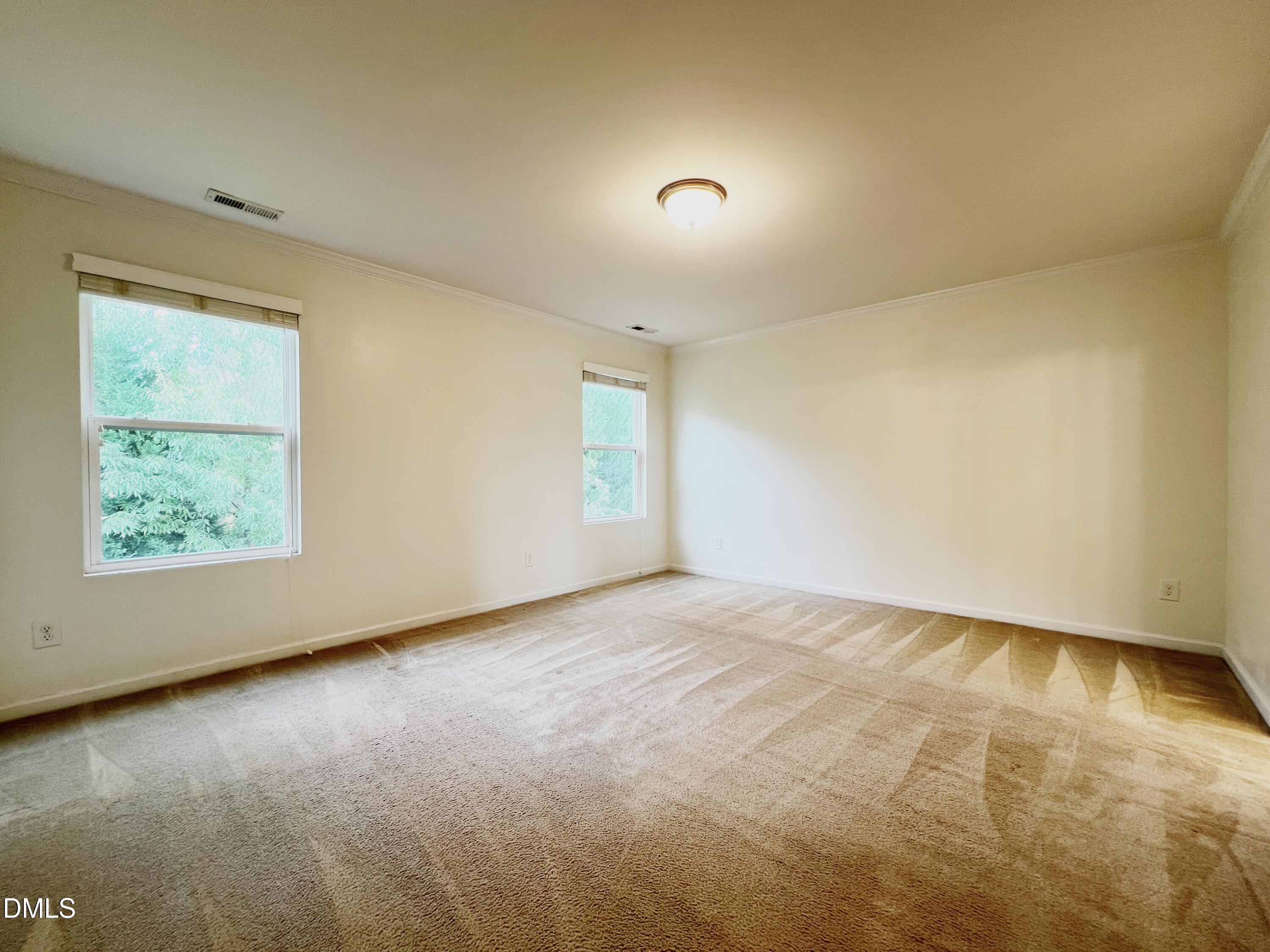 1495 Willowcrest Road Durham, NC 27703 - Photo 19 of 35 an empty room with a window