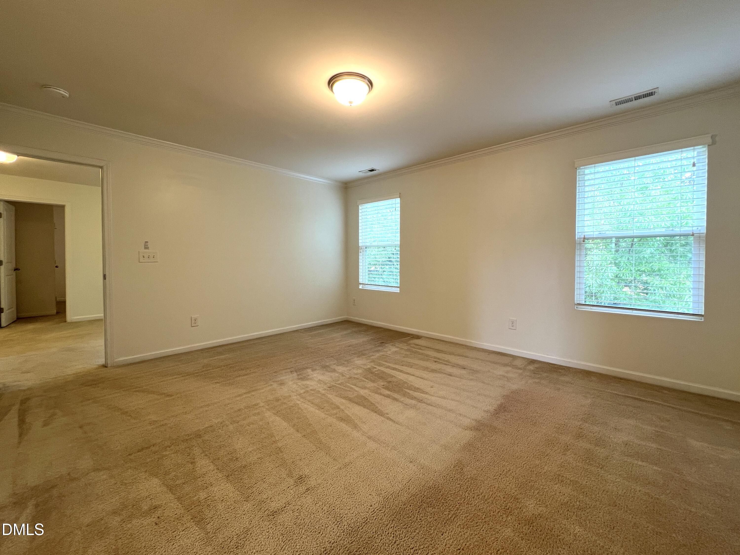 1495 Willowcrest Road Durham, NC 27703 - Photo 20 of 35 an empty room with windows