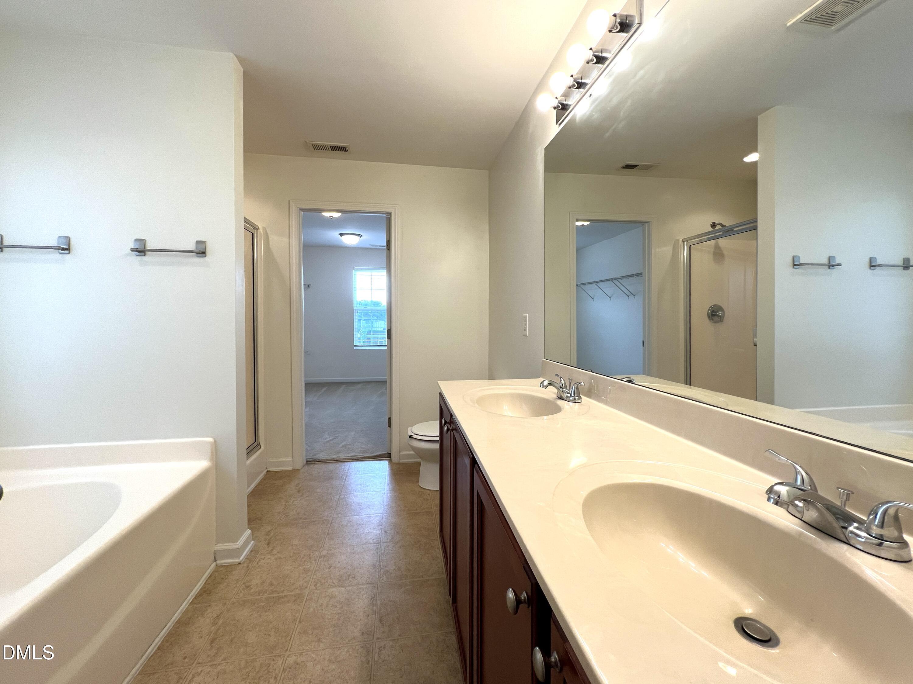 1495 Willowcrest Road Durham, NC 27703 - Photo 21 of 35 a bathroom with a sink and a bathtub